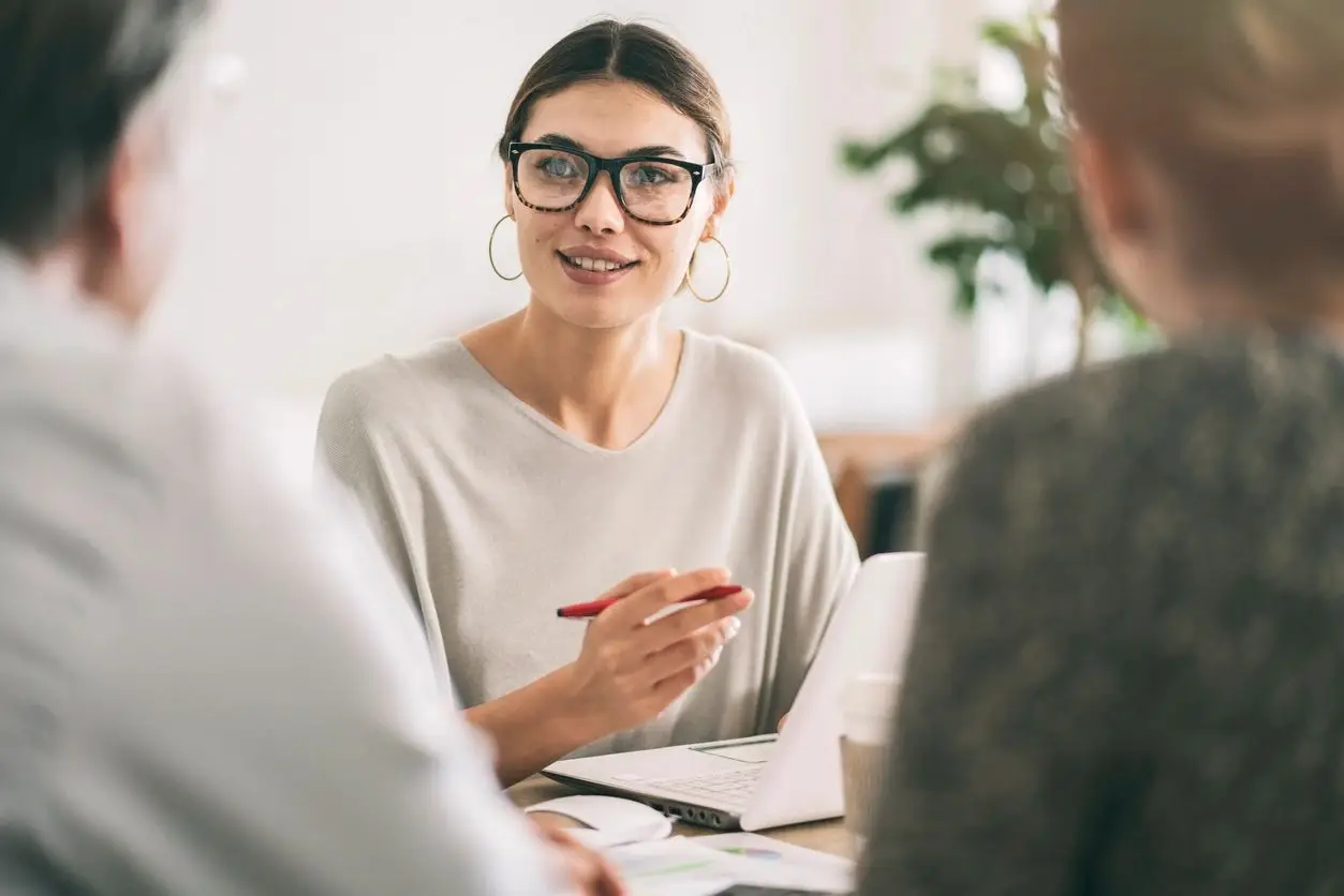 Property Conveyancing with Jacob Law – woman signing for a home loan.